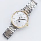 Longines wristwatch with white dial, gold-tone accents, and steel link bracelet