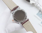 Longines watch, beige leather strap, stainless-steel case with engraved back.