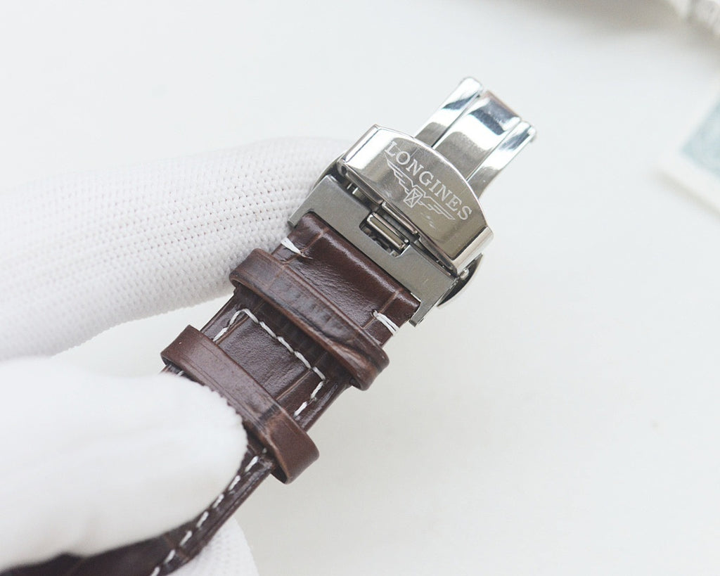 Longines automatic wristwatch clasp, silver case, brown leather strap