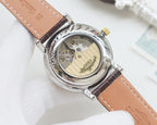 Longines automatic watch caseback, silver back plate, tan leather strap
