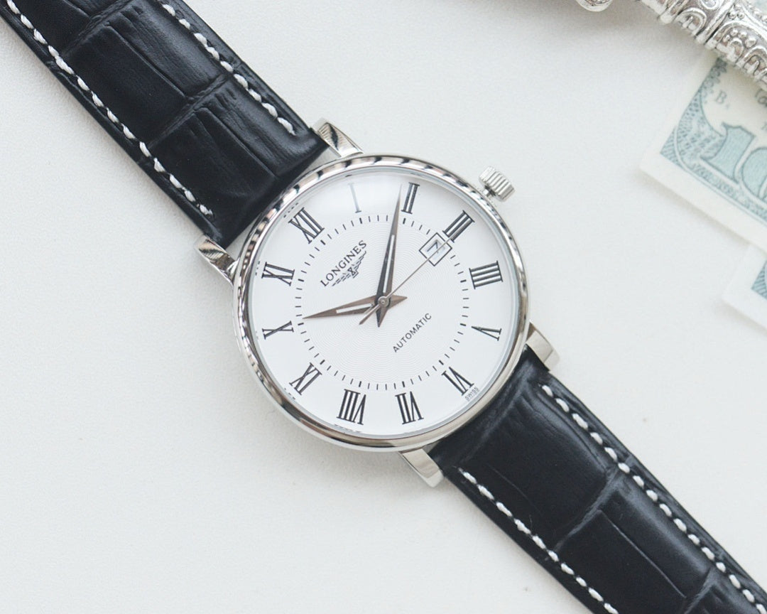Longines automatic wristwatch, silver-tone case, white dial, black leather strap, angled