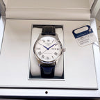 Longines wristwatch with white dial and black leather strap, Roman numerals and date display