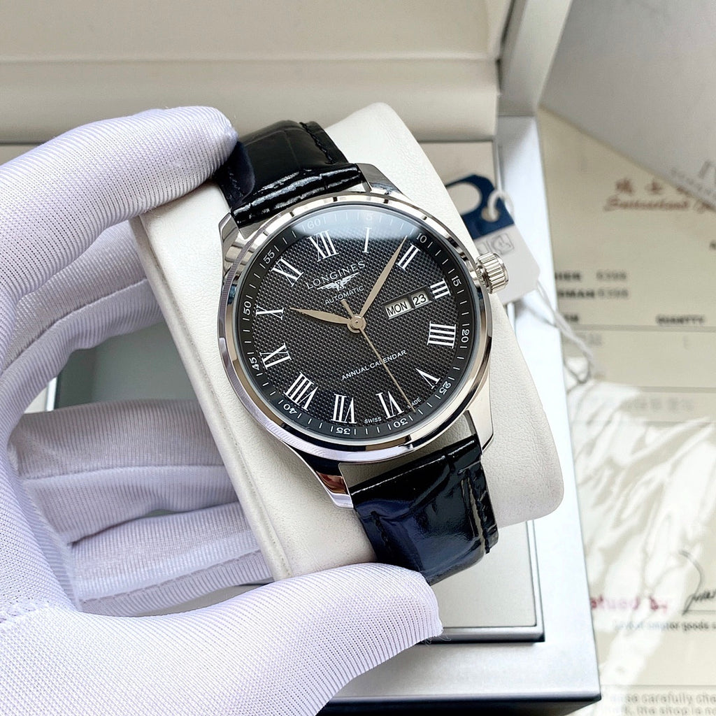 Longines wristwatch with dark dial, silver-tone case, black leather strap, Roman numerals