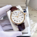 Longines wristwatch with white dial, gold-tone case, brown leather strap, Roman numerals