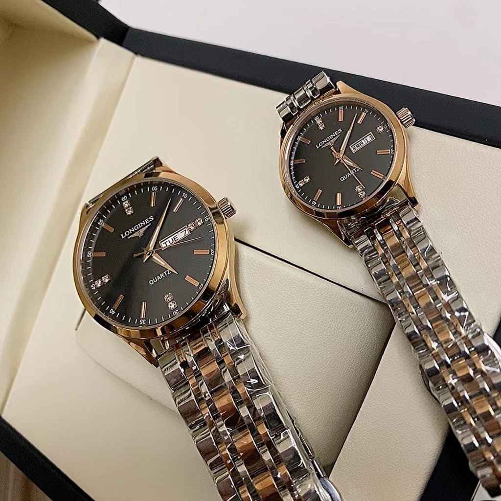 Longines watch pair on display, black dial silver metal link bracelet