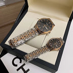 Longines watch pair on display, black dial and silver metal link bracelet