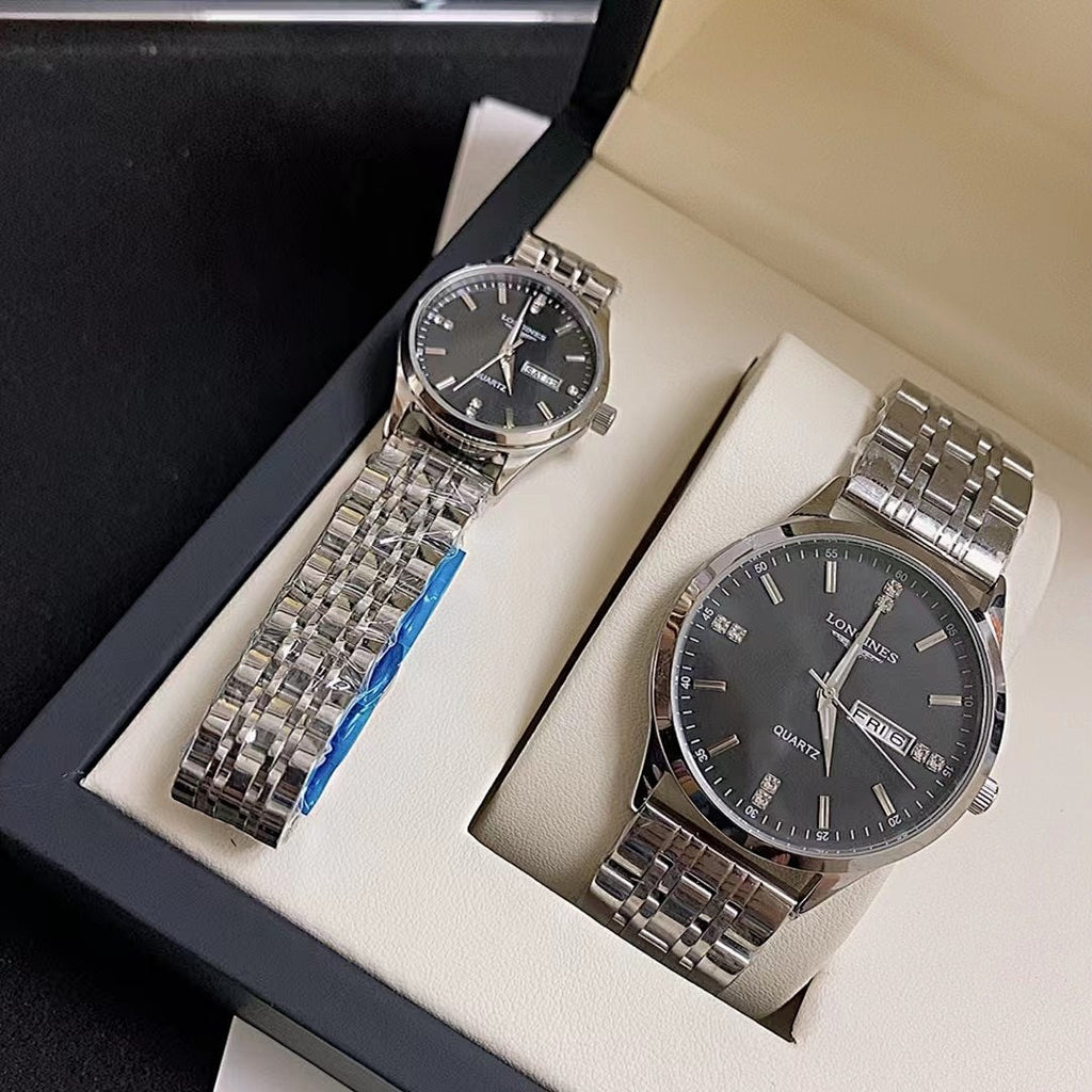 Longines watch pair in box, black dials with silver metal link bracelets