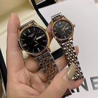 Longines watch with black dial and silver metal link bracelet