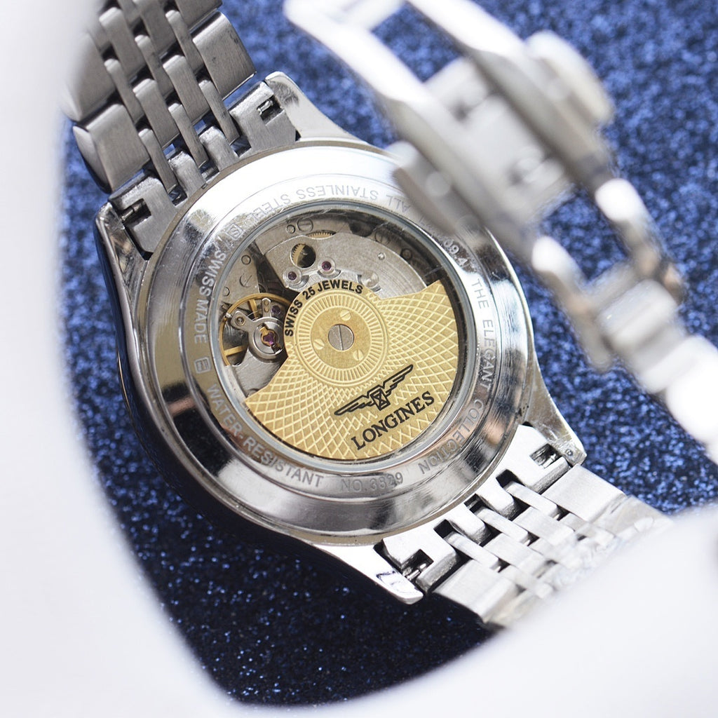 Longines watch case back with visible movement and stainless steel bracelet