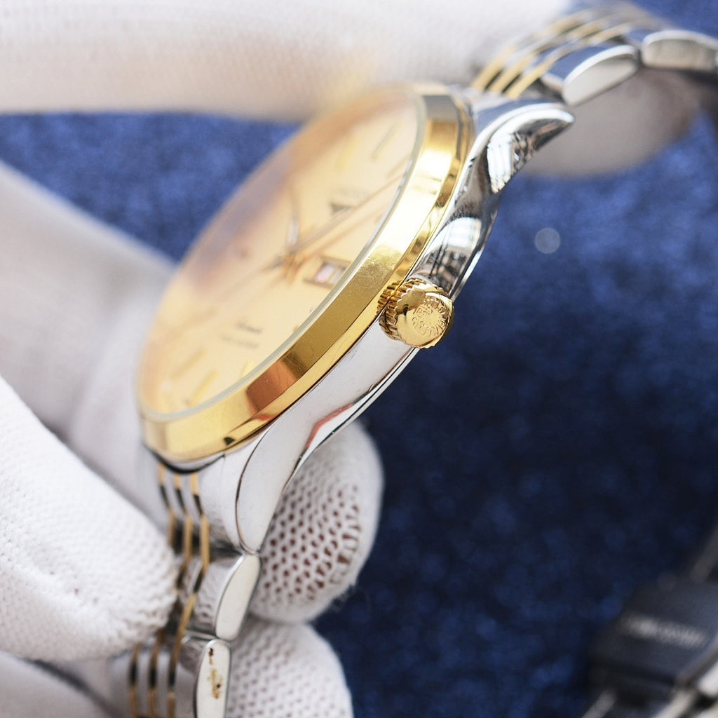 Longines watch side view with gold-tone crown and polished two-tone case