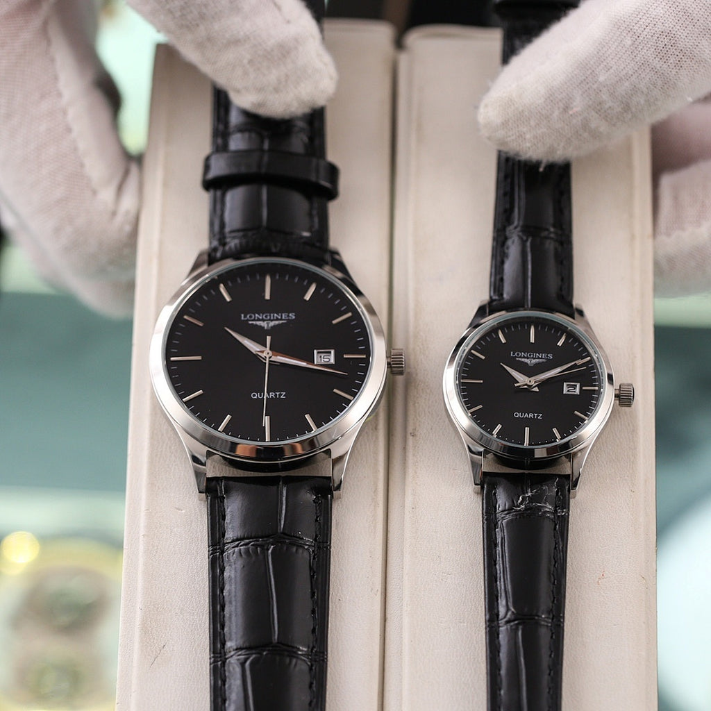 Two Longines quartz watches with black leather straps and black dials, date window visible