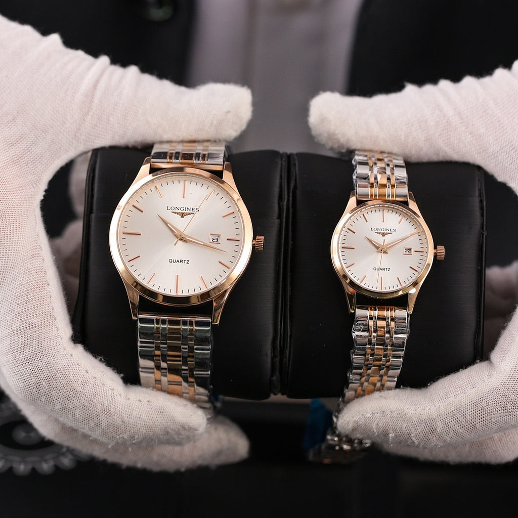 Two Longines quartz watches with gold-tone metal bracelets and white dials, date window