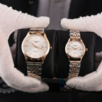 Two Longines quartz watches with gold-tone metal bracelets and white dials, date window