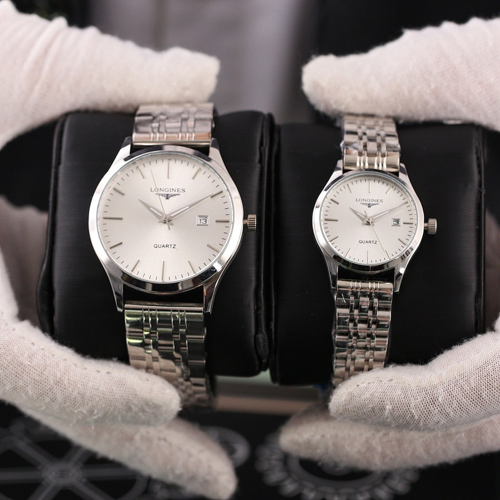 Two Longines quartz watches with silver-tone metal bracelets and white dials, date window