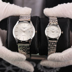 Two Longines quartz watches with silver-tone metal bracelets and white dials, date window