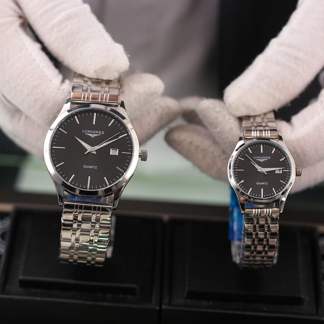 Two Longines quartz watches with metal bracelets and black dials, date window visible