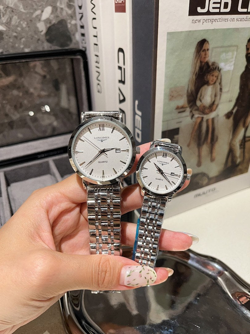 Longines watch with white dial and silver metal bracelet held in a hand, paired model