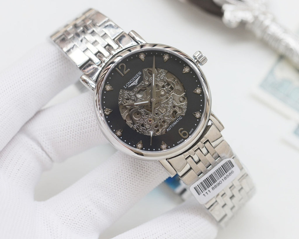 Automatic wristwatch with silver metal bracelet, dark skeleton dial