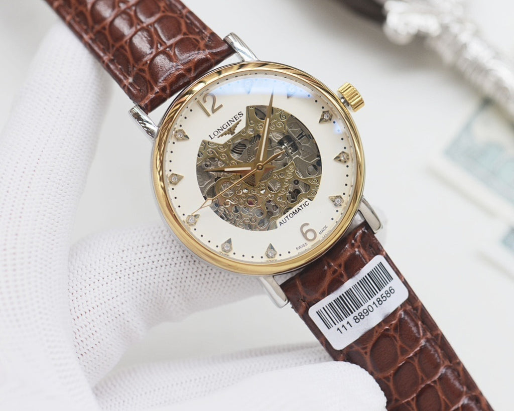 Automatic wristwatch with brown leather strap, gold case, white skeleton dial