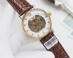 Automatic wristwatch with brown leather strap, gold case, white skeleton dial