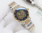 Automatic wristwatch with two-tone metal bracelet, dark skeleton dial