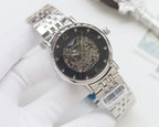 Automatic wristwatch with silver metal bracelet, dark skeleton dial