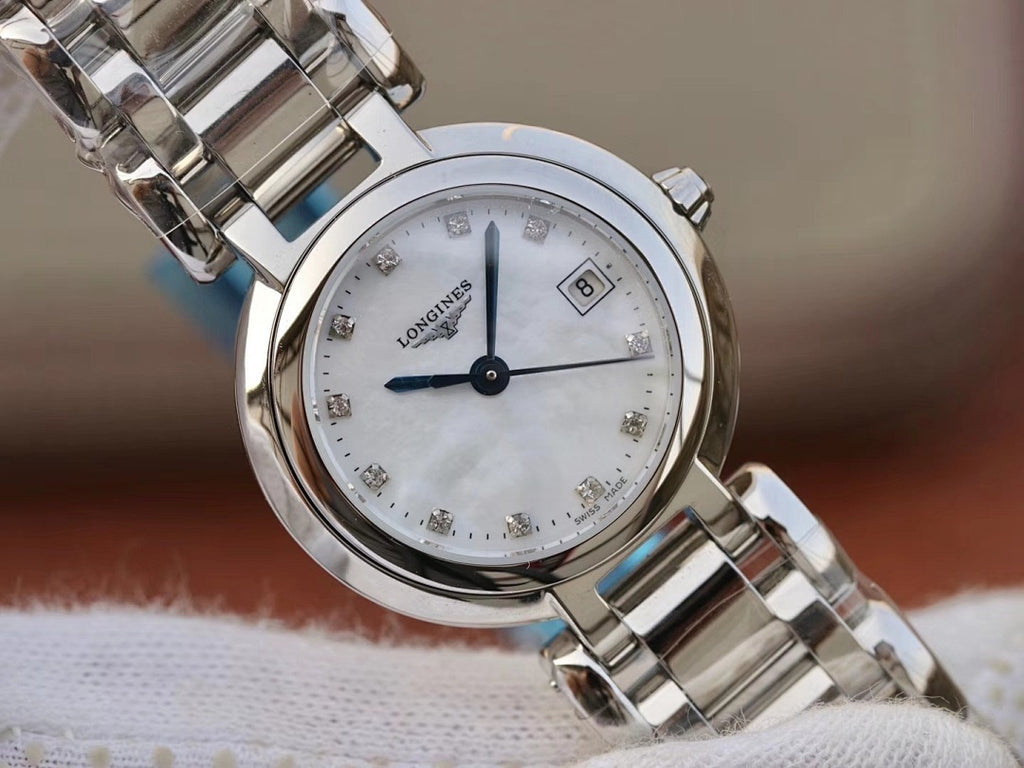 Longines watch with silver metal bracelet and white dial