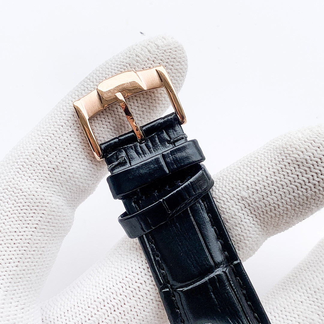 Longines watch clasp with black leather strap on rose-gold case