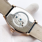 Longines case back with engraved pattern and blue accents, beige leather strap
