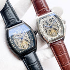 Two Longines skeleton watches with blue dials and leather straps: black and brown