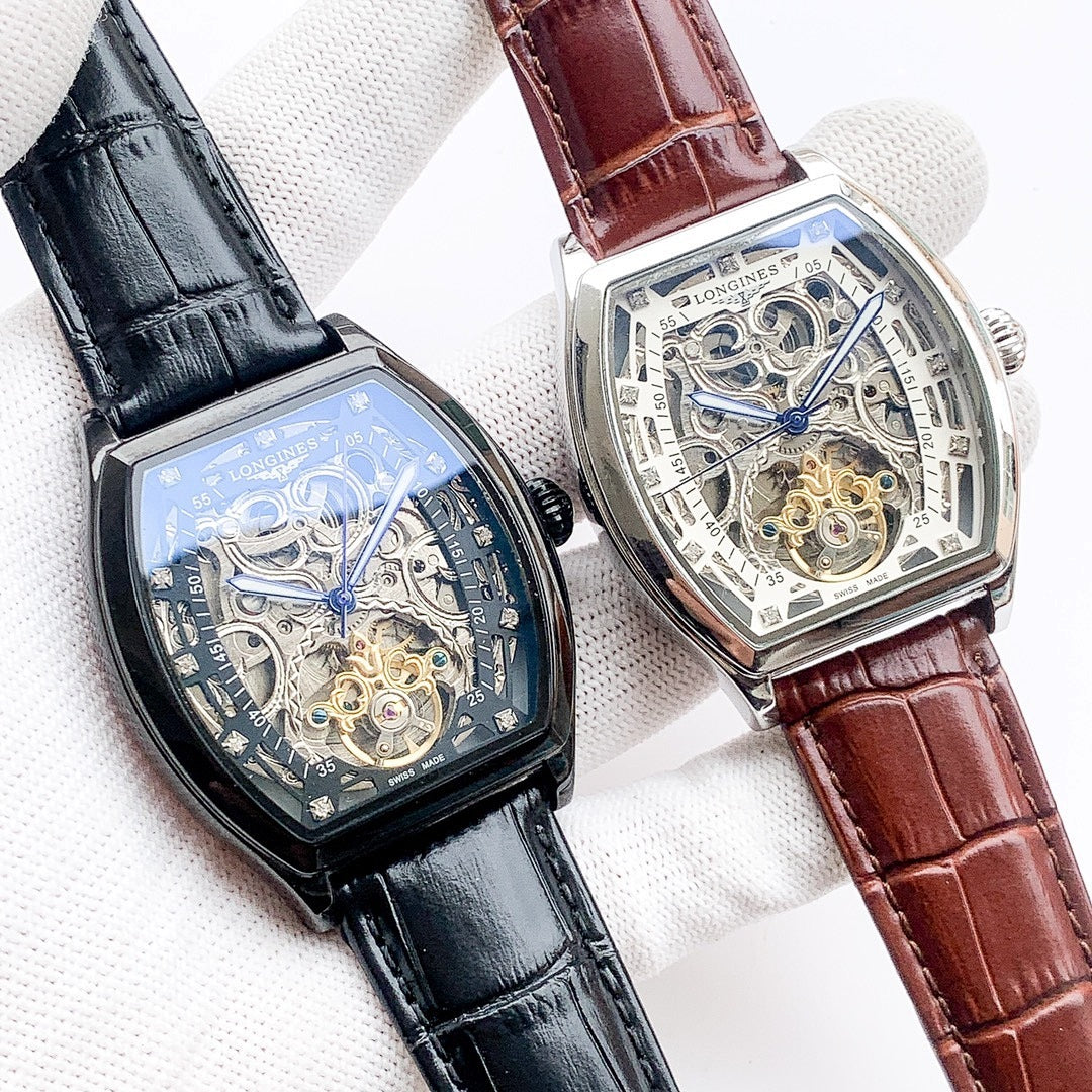 Two Longines skeleton watches with blue dials and leather straps: black and brown