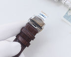 Longines watch with brown leather strap and silver-toned case, side view