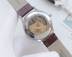 Longines watch caseback with brown leather strap, see-through movement window