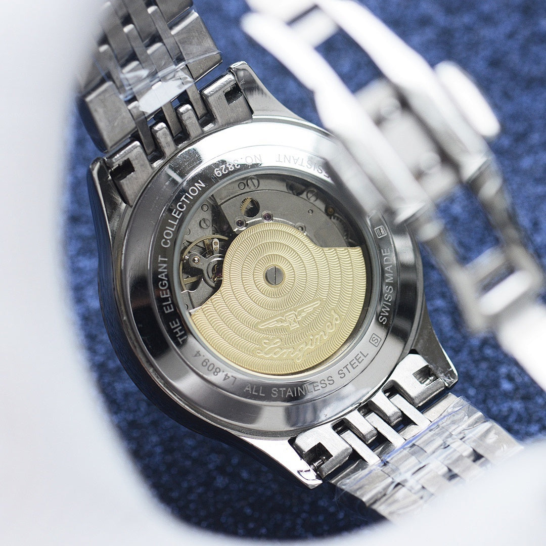 Stainless steel watch caseback with engraved pattern and Swiss Made text, linked bracelet