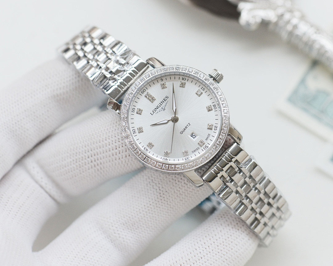 Wristwatch with silver metal bracelet, white dial and crystal-studded bezel