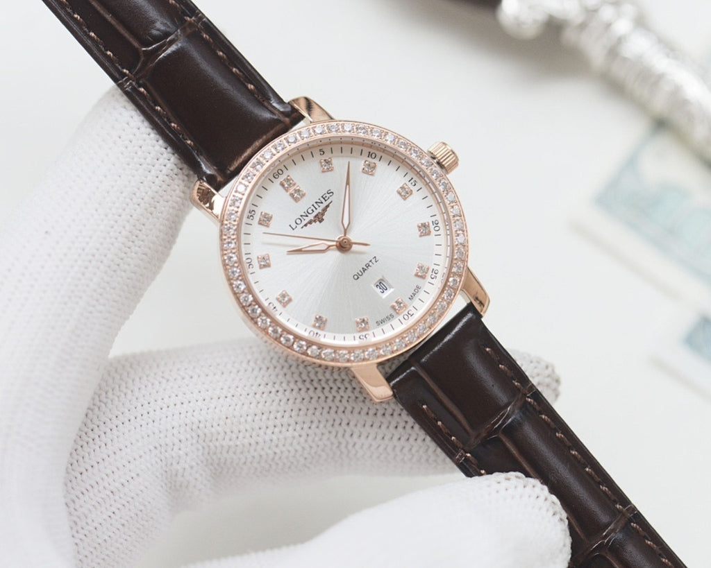 Wristwatch with dark brown leather strap, rose-gold case and white crystal bezel dial