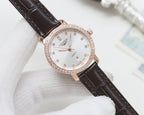 Wristwatch with dark brown leather strap, rose-gold case and white crystal bezel dial