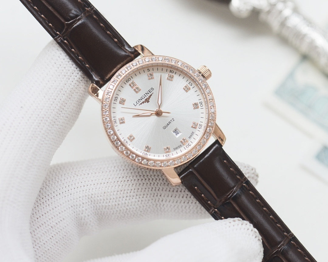 Wristwatch with dark brown leather strap, rose-gold case and white crystal bezel dial