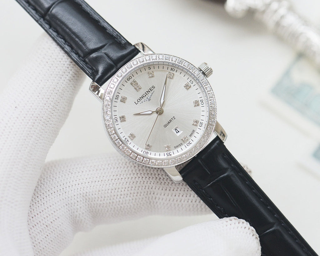 Wristwatch with black leather strap, silver case and white crystal bezel dial