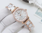 Wristwatch with rose-gold case and two-tone link bracelet, white crystal bezel dial