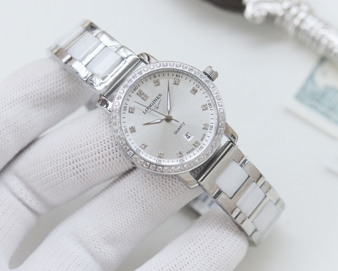 Wristwatch with silver case and link bracelet, white crystal-studded bezel dial