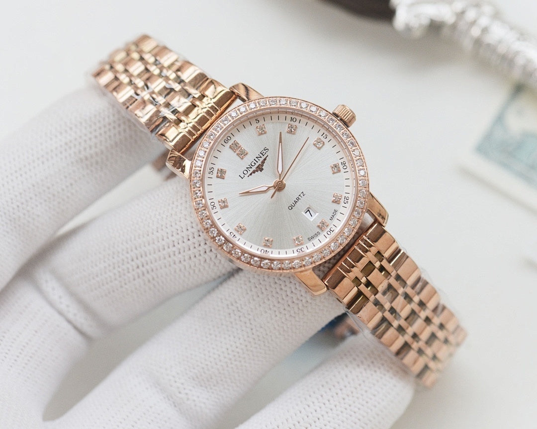Longines watch with rose-gold tone mesh bracelet and white crystal bezel dial