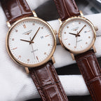 Longines watch with white dial, gold-tone case, brown leather strap, quartz date window.