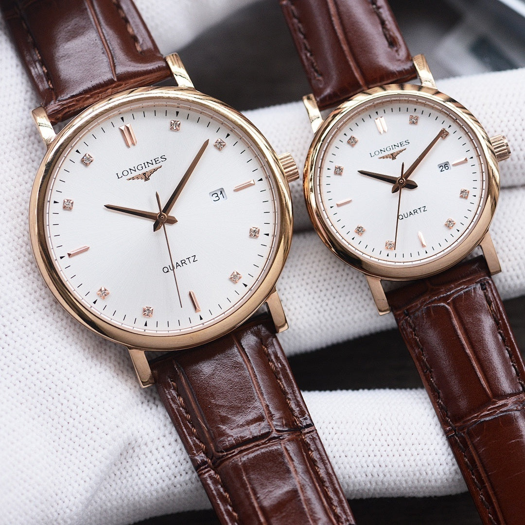 Longines watch with white dial, gold-tone case, brown leather strap, quartz date window.