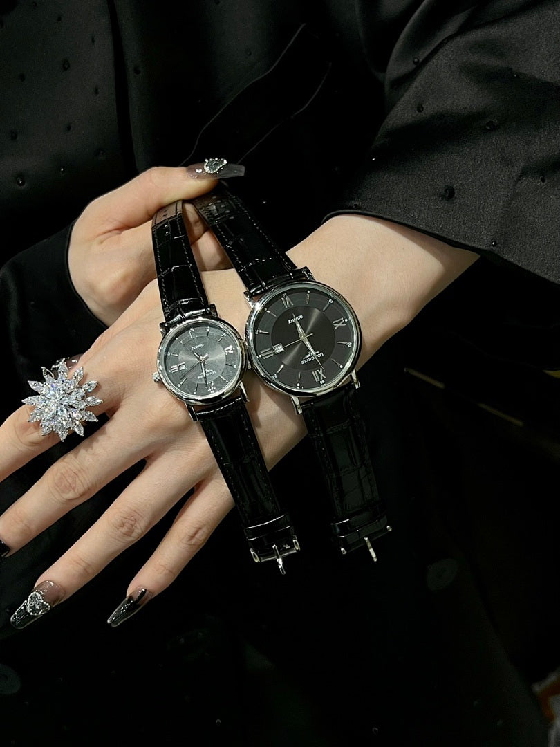 Pair of luxury wrist watches with black leather straps and silver-tone dials