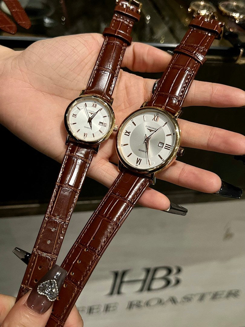Pair of luxury wrist watches with brown leather straps and white dials