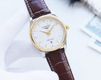 Longines wristwatch close-up with white dial, gold bezel, brown leather strap