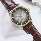 Longines watch with gold-tone bezel, gray dial, brown leather strap, baton markers