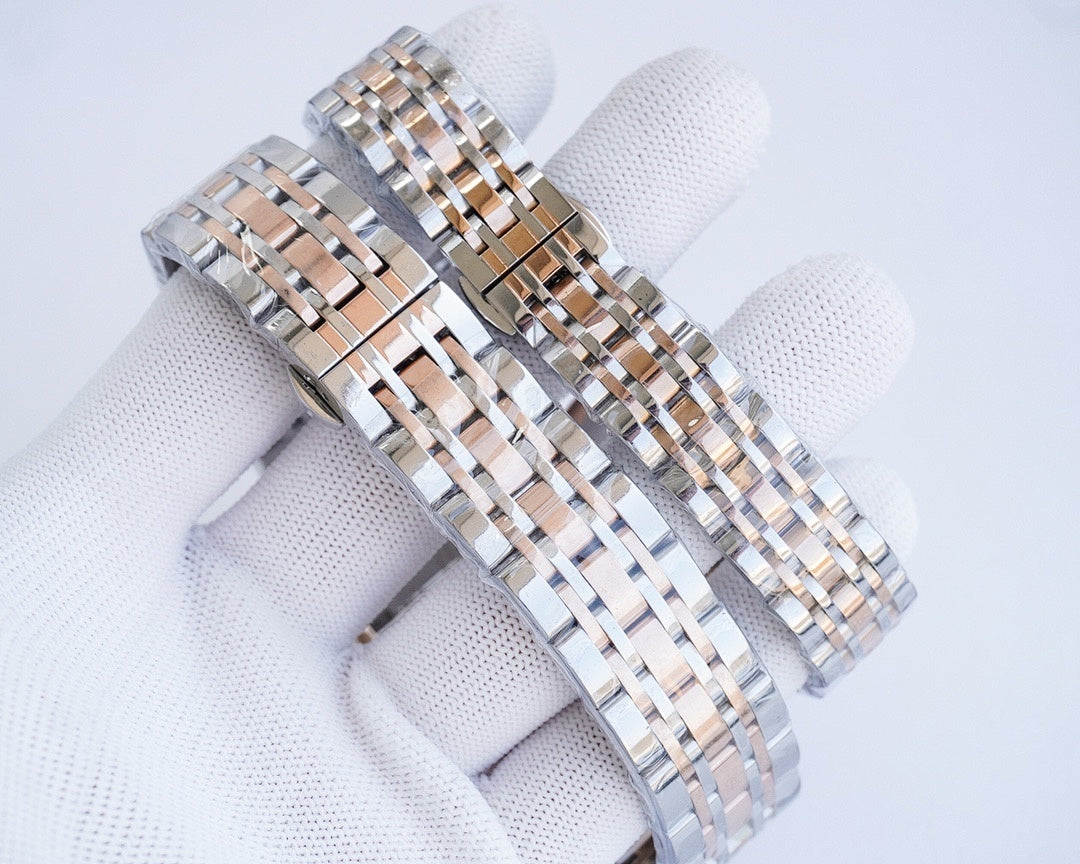 Two-tone metal bracelet watch with rose-gold bezel accents