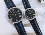 Longines wristwatches with black leather straps and dark dials, Roman numeral markers